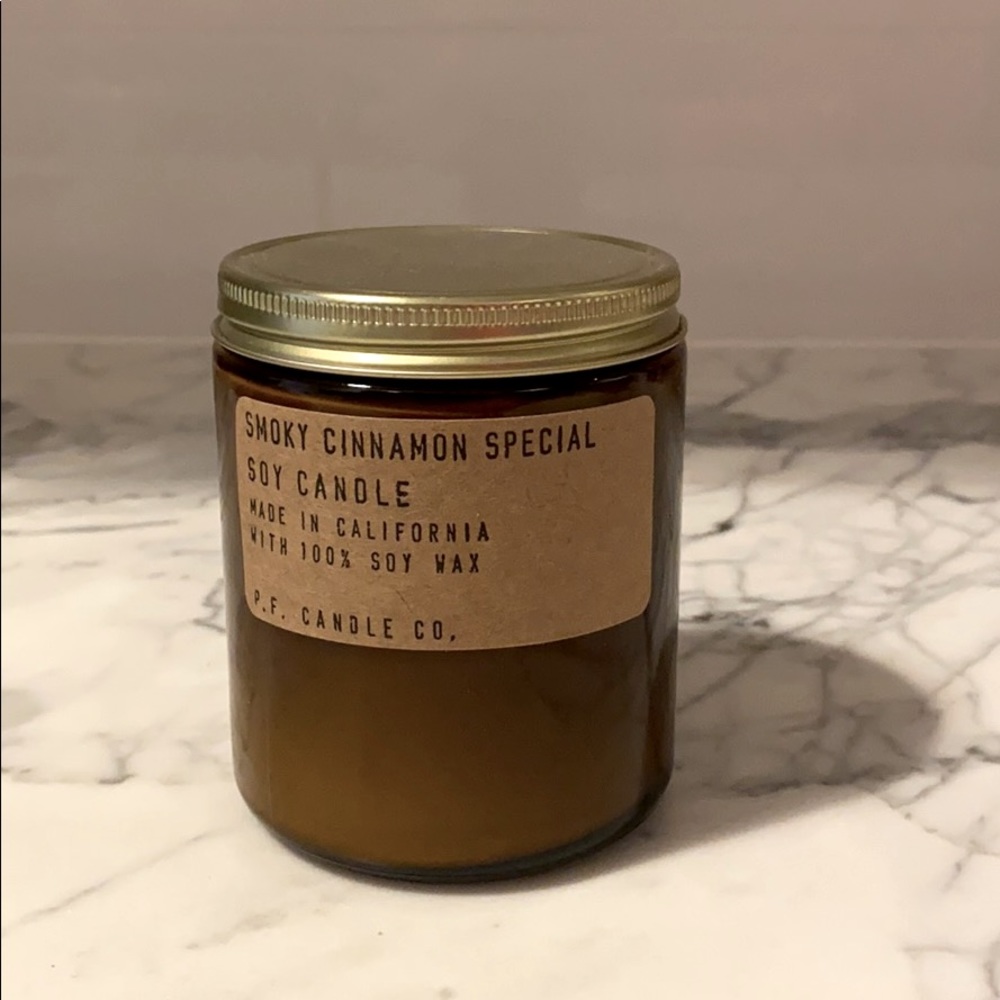 Smoky cinnamon candle in glass jar